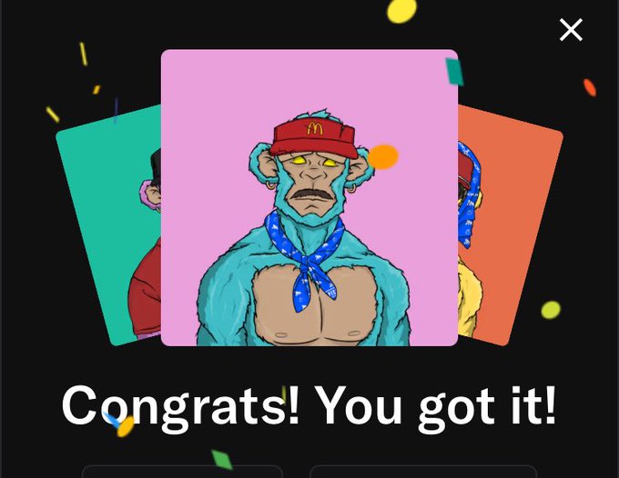 A digital congratulatory screen displaying 'Congrats! You got it!' featuring a turquoise cartoon monkey character wearing a red McDonald's visor and a blue bandana.