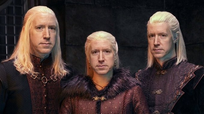 A woman with long blonde hair is standing between two blonde men in a dark, medieval setting.