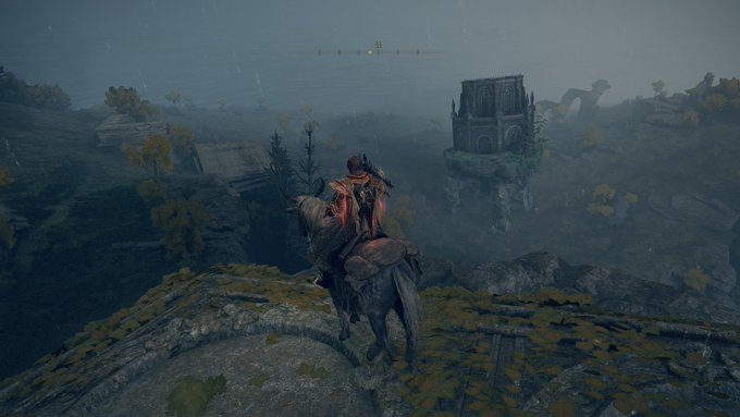 A screenshot from the video game Elden Ring showing a character on horseback overlooking a foggy landscape with a castle structure in the distance.