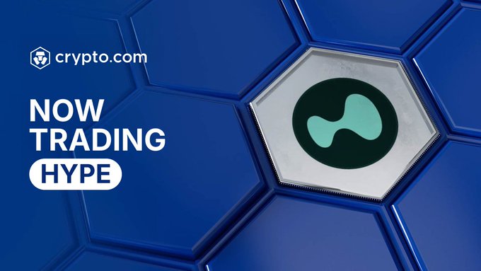 A Crypto.com promotional graphic announcing that Hyperliquid ($HYPE) is now trading on the Crypto.com App, featuring the Crypto.com logo alongside the green HYPE token logo set against a blue hexagonal background, with bold white text reading "NOW TRADING HYPE."