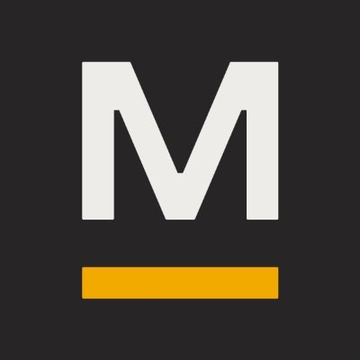 The image displays a stylized white letter "M" above an orange horizontal bar on a black background, representing the logo of MARA Holdings (ticker: MARA). The caption relates to the announcement that MARA has acquired a 1,200-acre Texas site for a 2 GW digital infrastructure campus designed for flexible compute operations between Bitcoin ($BTC) mining and AI workloads.