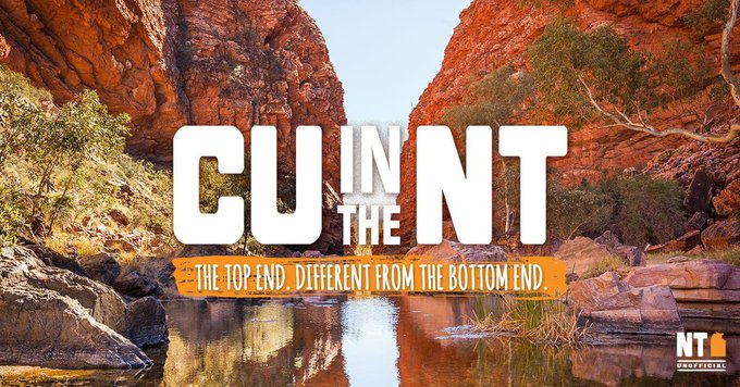 A tourism advertisement for the Northern Territory, Australia, showing a scenic gorge with red rock cliffs and a waterfall, featuring text "CU IN THE NT - THE TOP END, DIFFERENT FROM THE BOTTOM END" with the NT official logo.