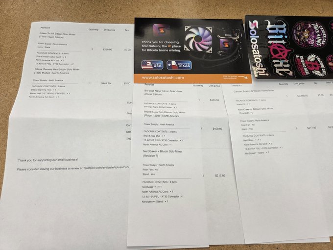 Collection of printed receipts and invoices from Solosatoshi and Trustpilot showing purchases of Bitcoin Solos Miner items, power supplies, and neon signs, with a thank-you note for supporting small business.