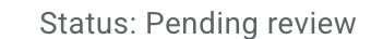 A blurred, motion-streaked image displaying the text 'Status: Pending review' in tall, dark lettering against a white background.