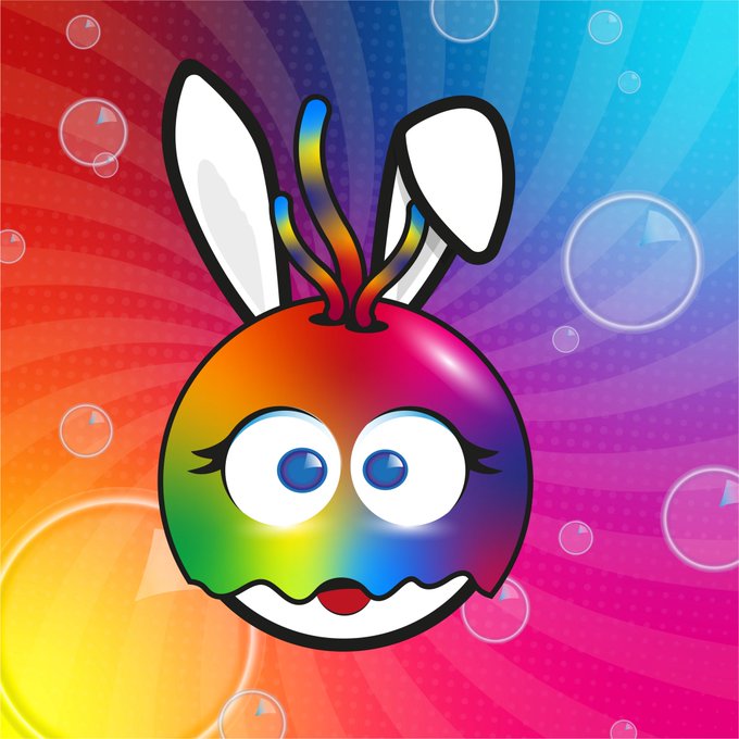 The image features a colorful cartoon rabbit with big blue eyes, a white face, and a rainbow-colored body. It appears to be smiling or making a funny face as if it's greeting someone. The background of the image consists of bubbles floating in various colors such as pink, purple, orange, yellow, green, and blue. The bubbles are scattered throughout the image, creating a vibrant and lively atmosphere. In the bottom right corner of the image, there is text that reads "Happy Wednesday everyone".