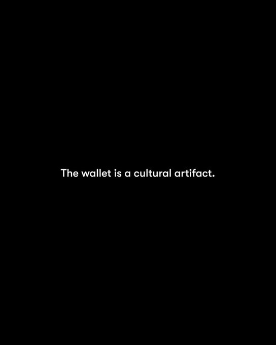 A black screen with centered white text reading, "The wallet is a cultural artifact."
