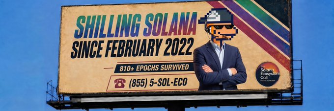A billboard advertisement reading 'SHILLING SOLANA SINCE FEBRUARY 2022' featuring a pixelated character in a suit with '810+ EPOCHS SURVIVED' and a phone number (955) 5-SOL-ECO for the Solana Ecosystem Call.