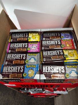 A box containing multiple Hershey's milk chocolate bars packaged in collaboration with Pokémon, featuring Pikachu, Snorlax, and other Pokémon designs on the wrappers.