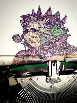 A colorful, sketch-style illustration of a dinosaur or dragon appears to be drawn on paper emerging from a typewriter.