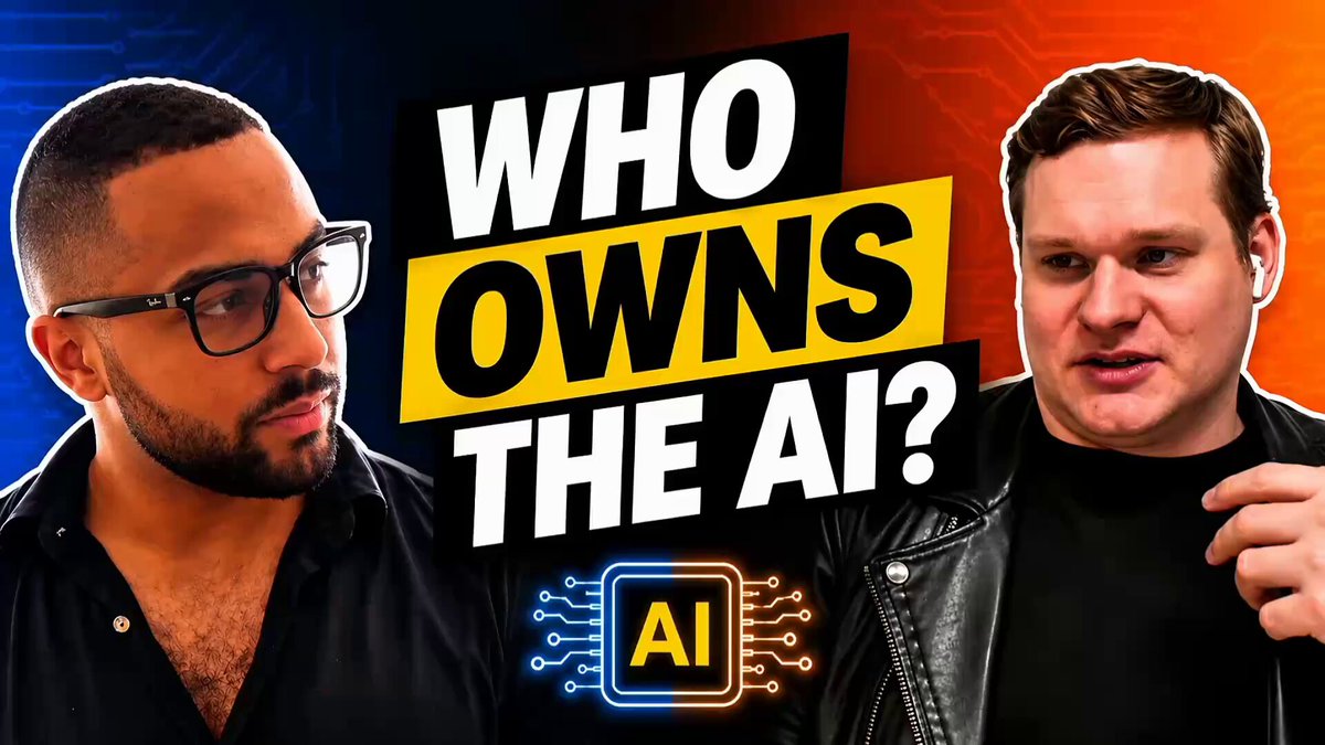 The image features two men wearing glasses, with one man's hand resting on his hip and another man holding up a sign that says "Who Owns the AI?". The background of the image has an orange and blue color scheme.