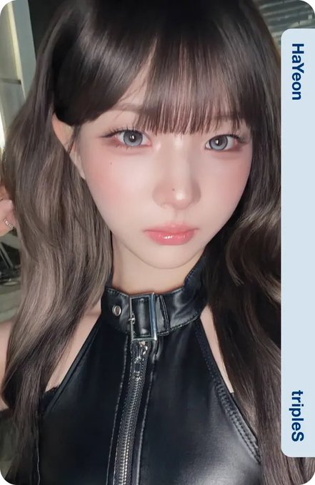 A selfie of a young woman with long dark hair and bangs wearing a black leather top, labeled "Hayeon" and "triples" on the right side.