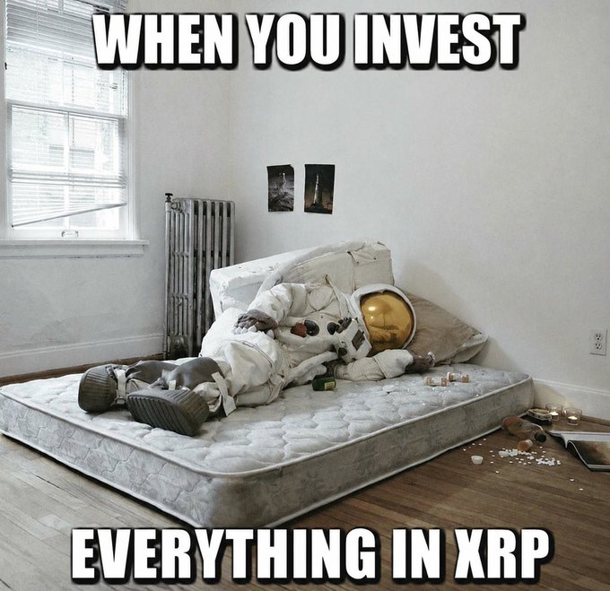 The image shows a person in an astronaut suit lying face-down on a bare mattress in a sparse, dimly-lit room, with text reading "WHEN YOU INVEST EVERYTHING IN XRP." The meme humorously contrasts the post's bold claim about XRP's strong fundamentals with the reality of someone who went "all in" on the cryptocurrency facing the consequences—depicting a life that's crashed and burned despite the poster's optimistic pitch.