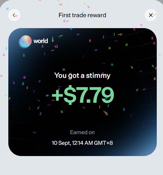 A "First trade reward" notification from World showing a "+$7.79" stimmy earned on 10 Sept at 12:14 AM GMT+8, displayed with celebratory confetti. The image relates to the post by illustrating the reward the user claimed on the World platform using their Phantom Wallet.