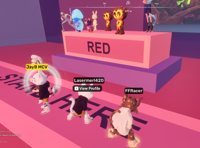 A screenshot from a video game shows avatars with usernames like 'JayB MCV', 'Lasermerl420', and 'FFRacer' standing on a pink platform near a display labeled 'RED'.