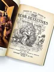 An open book showing the title page of 'The Bear Detective' by Seymour Eaton, part of the 'Teddy's Trunk' series, published by Edward Butler & Co. in Boston.