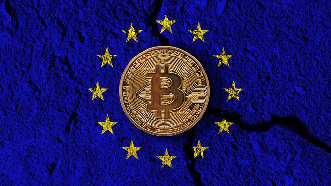A Bitcoin coin centered on a textured blue background featuring the European Union's circle of yellow stars, with a crack running through the surface.