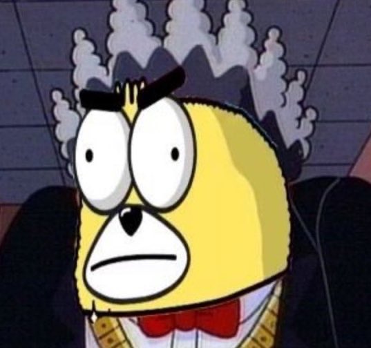 A cartoon character resembling a yellow monkey or bear with a red bow tie and smoke or steam billowing from its head, looking distressed with wide eyes.