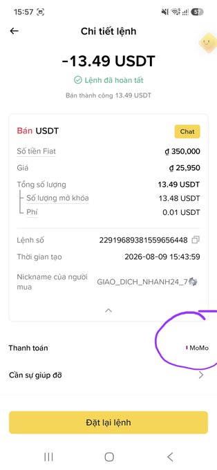 A Vietnamese-language transaction confirmation screen showing a completed USDT sale of -13.49 USDT at a rate of 25,950, with payment processed via MoMo (circled in purple) for user "GIAO_DICH_NHANH24_7".