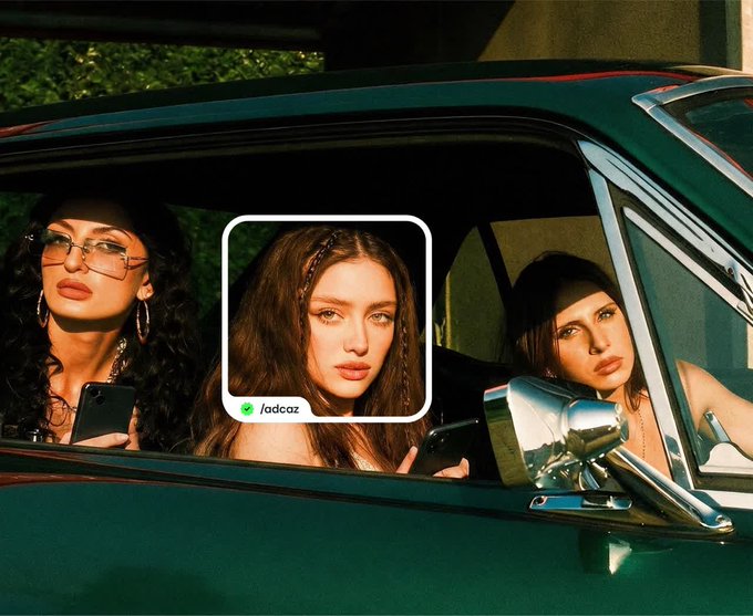 Three women are visible inside a green car, with a profile picture overlay in the center showing one of the women with the handle '/adcaz' next to a green verified checkmark.