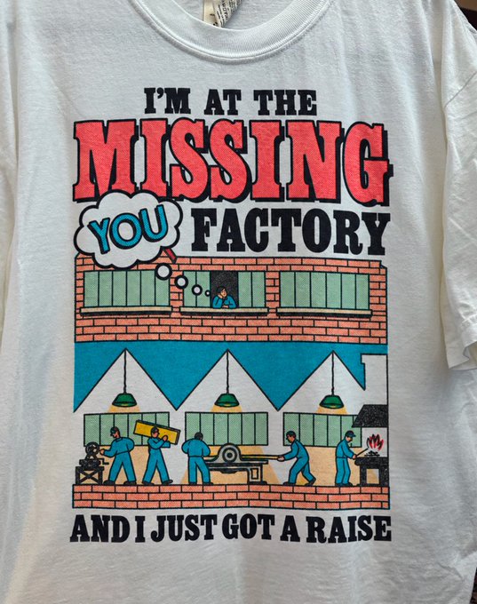 A white t-shirt features a cartoon factory illustration with the text 'I'M AT THE MISSING YOU FACTORY AND I JUST GOT A RAISE.'
