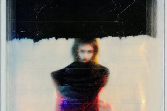 A blurry, glitch-art style portrait shows a dark-haired figure in a high-collared outfit emerging from a cloud of white against a black background, evoking a haunting, dreamlike atmosphere. The ethereal aesthetic complements the post's reference to "Juliet in the shell," lending a cyberpunk, mysterious mood to the NFT mint request priced at 0.5 ETH on SuperRare (SR).