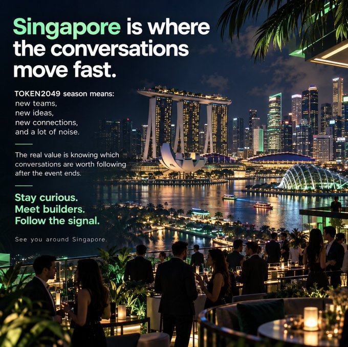 A rooftop networking gathering at night overlooks Singapore's illuminated Marina Bay skyline, featuring the iconic Marina Bay Sands and ArtScience Museum, accompanying promotional text about TOKEN2049 that reads "Singapore is where the conversations move fast" alongside messaging encouraging attendees to "Stay curious. Meet builders. Follow the signal."