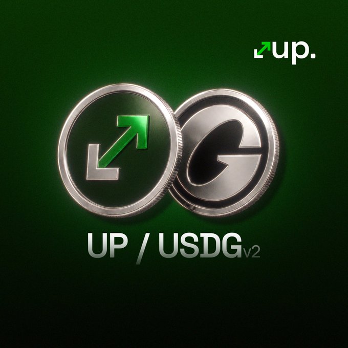 Promotional graphic for the UP/USDG v2 cryptocurrency trading pair, featuring two silver coins with green and dark G symbols on a dark green background.