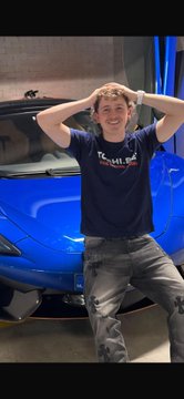 A man in a "Twisted Tea" shirt poses with his hands on his head in front of a blue sports car, celebrating a winning streak thanks to tips from @boru_crypto. The post praises the crypto trader for consistently delivering profitable picks.