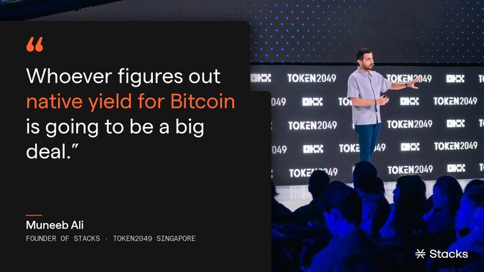 Muneeb Ali, founder of Stacks, speaks at TOKEN2049 Singapore declaring "Whoever figures out native yield for Bitcoin is going to be a big deal," with the image promoting Bitcoin staking on Stacks as the solution to the yield disparity between ETH and Bitcoin ETF holders.