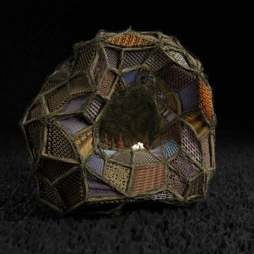 The image features a large, intricately designed sculpture made from yarn or fabric that resembles a ball with many different colors and patterns. The sculpture is placed on a black surface, which contrasts with its colorful appearance. The text "Many thanks to @YinYangYoeshi for collecting an edition of my sculptural Textile on @objktcom" suggests that the artwork was created by a person named Yin Yang Yoeshi, who has been collecting and sharing their sculptures online. The post also mentions that there are two editions left in stock at this website.