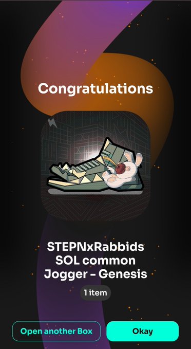 The image shows an app screen with a cartoon cat wearing sneakers, which appears to be a logo or design element from the GGBox app. The text "Congratulations" is displayed above the cat's head, indicating that the user has achieved something related to the app. The app also mentions that it is open for another box and encourages users to try out the app by opening an additional box.