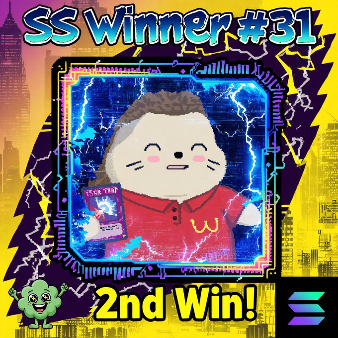 The image features a cartoon character wearing a red shirt with a smiley face holding a sign that says "Second Win!". The background of the image shows an illustration of a city skyline, indicating that this victory could be related to a contest or competition held in a city setting.