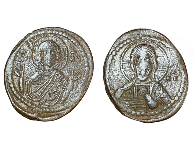 Two views of an ancient bronze Byzantine coin showing religious figures with Greek lettering, including 'MΘ' and 'IC XC' flanking the figures' heads.