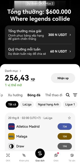 A mobile app interface displaying an OKX prediction market for football with a total prize of $600.000, showing a LaLiga match between Atletico Madrid (73¢) and Malaga (10¢) with a draw at 19¢.