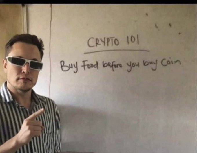 A man wearing sunglasses points at a whiteboard reading "CRYPTO 101: Buy Food before you buy Coin," humorously tying into a Sunday morning greeting with a playful reminder about financial priorities.