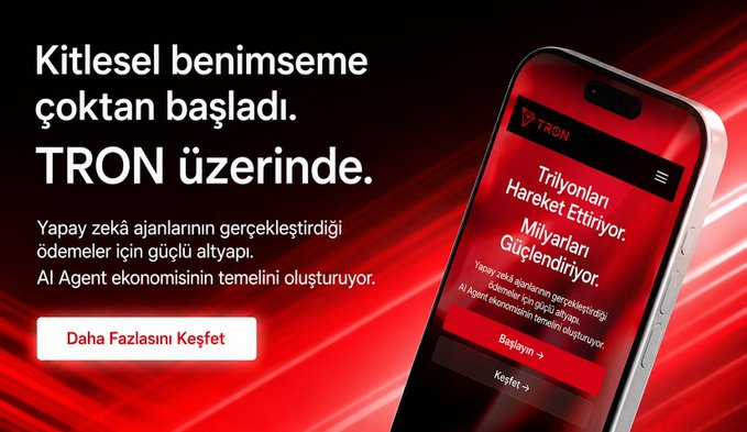 The image shows a cell phone with an advertisement for Tron, which is displayed on its screen. The text on the phone's screen reads "Kitlesel benimseme çoktan başladı. trondao.org". This suggests that the phone might be promoting or advertising the Tron brand and its services.
