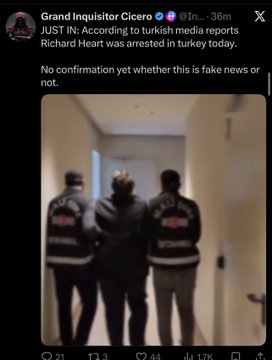 A Twitter/X post by Grand Inquisitor Cicero reports "JUST IN: According to turkish media reports Richard Heart was arrested in turkey today. No confirmation yet whether this is fake news or not," accompanied by a blurry image of three individuals in police jackets escorting a person down a hallway. The post ties to the caption's claim of Richard Heart's arrest, which appears to have triggered a market dump in Pulsechain.