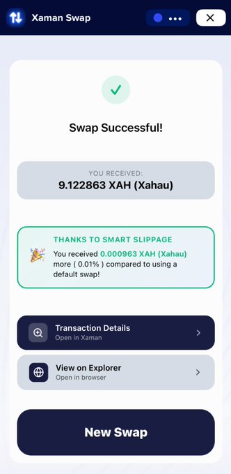 The image shows a phone screen displaying a message from an XRP Ledger app called "XAMAN SWAP". The message congratulates the user for successfully completing their transaction, which was completed using the XRPL Ledger application. The text on the screen reads "Thank you to Smart Slipage for using XRPL to complete your transaction. You received 9,838881.XAH (Xahau) and 0,000928.XAH (Xahau). You were compared to another user who used a different payment method." The phone is placed on a table with a brown surface.