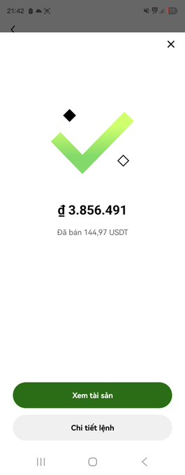 Binance order confirmation screen showing a successful conversion: đ 3,856.491 sold for 144.97 USDT, with 'Xem tài sản' and 'Chi tiết lệnh' buttons.