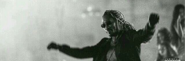 The image features a black and white photo of a person with dreadlocks, wearing sunglasses and holding their arms outstretched. The background appears to be a wall or a building, which could potentially be an album cover for "Arx" by Summer.