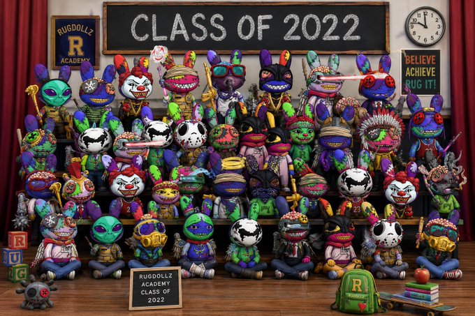 A colorful illustration of a classroom of diverse monster and alien plush toys, with a chalkboard reading 'CLASS OF 2022' and 'RUGDOLLZ ACADEMY'.