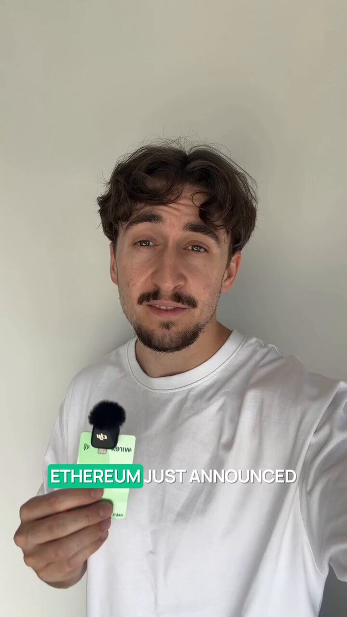 The image features a man wearing a white t-shirt holding up a green card with the text "Ethereum Just Annouced" written on it. The man appears to be posing for a photo, possibly sharing his excitement about the new direction of Ethereum or an upcoming project related to it.