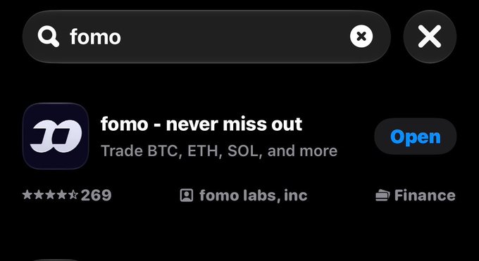 An app store search result for 'fomo', showing the app 'fomo - never miss out' by 'fomo labs, inc' to trade BTC, ETH, SOL and more, with an 'Open' button.