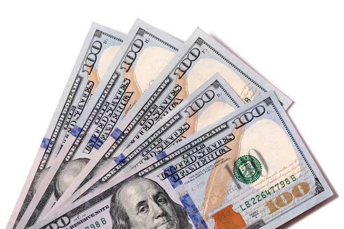 A fan of five U.S. $100 bills is fanned out, prominently displaying Benjamin Franklin's portrait and the "100" denomination, symbolizing significant capital. The image visually represents the "$11.2 billion" in crypto funding mentioned in the post, illustrating the large sums of money flowing into licensed crypto companies in the first half of 2026.