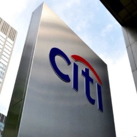 A Citi (Citibank) sign is shown against a city skyline backdrop. The image accompanies a breaking news headline claiming Citibank predicts Bitcoin will reach $113,000 within the next 12 months.