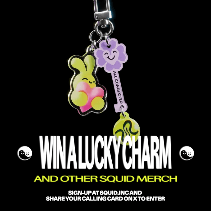 A promotional graphic featuring colorful Squid Game-style lucky charm keychains, advertising 'WIN A LUCKY CHARM AND OTHER SQUID MERCH' with sign-up details at SQUID.INC.