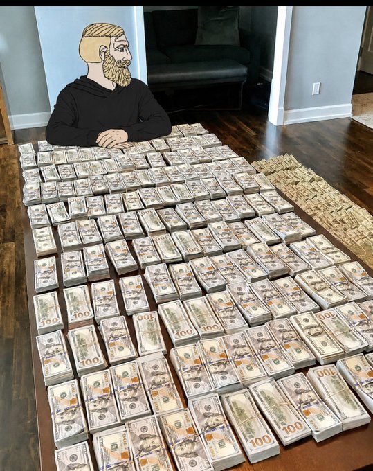An image showing a person at a table covered with massive stacks of $100 bills, with a pixel art overlay of a bearded man's head on the person.