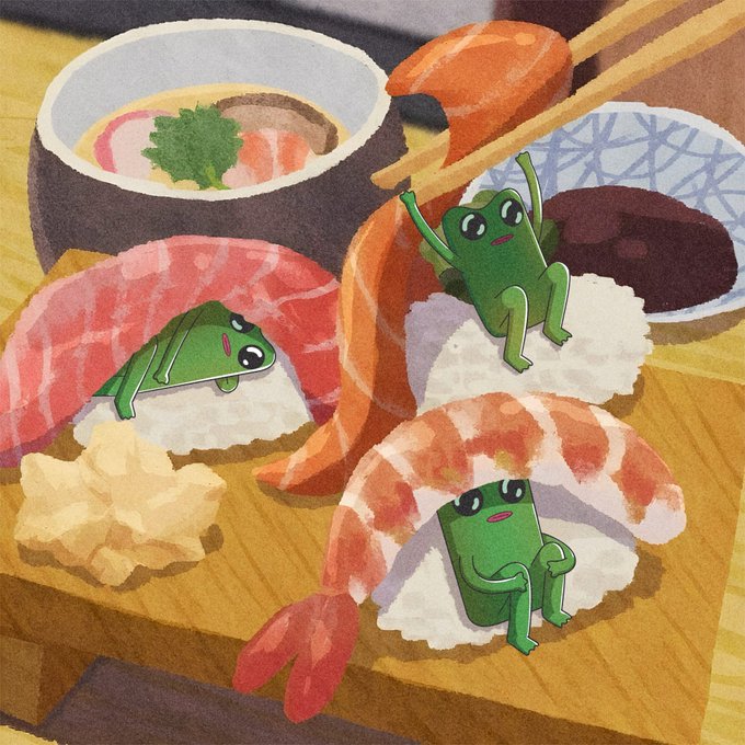 An illustration shows three small green frog characters relaxing on and inside various pieces of sushi, including shrimp nigiri and salmon rolls, with chopsticks picking up a piece of salmon in the background.