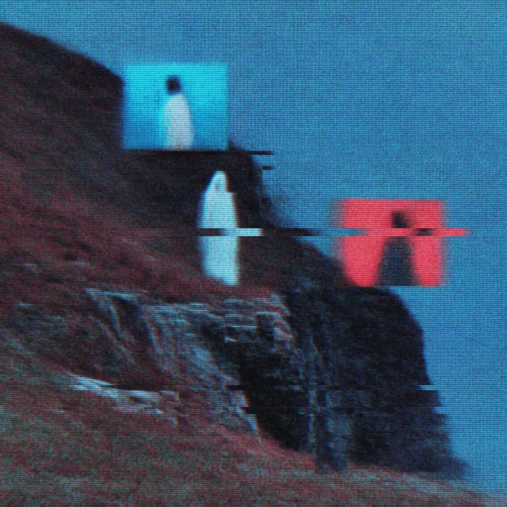 The image shows a cliff with three people standing at different heights, one person closer to the bottom of the cliff and two others further up. The photo has a blue tint that makes the colors appear more vibrant than they would be under normal lighting conditions.