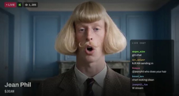 A livestream features a person named 'Jean Phil' wearing a blonde bob wig and a mustache, with live chat messages from users like 'degen_nika' and 'based_kev' visible on the right.